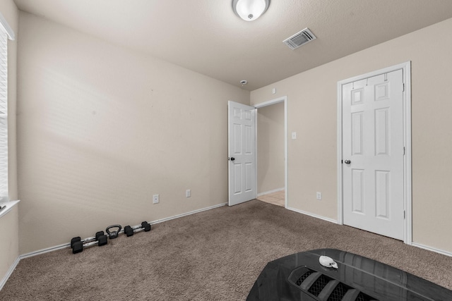 unfurnished bedroom with carpet flooring