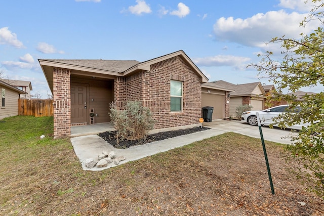 ranch-style home featuring a garage and a front lawn