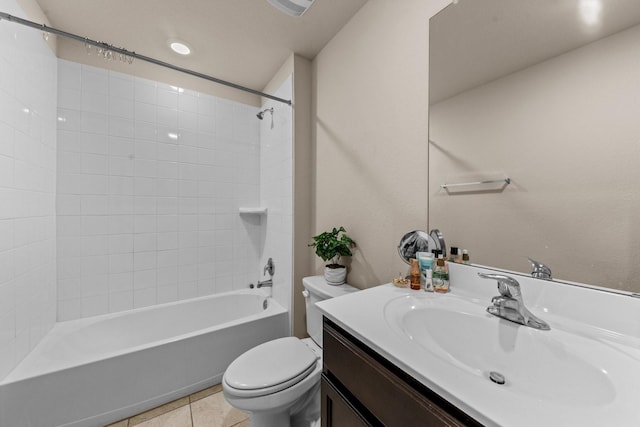 full bathroom with shower / tub combination, toilet, vanity, and tile patterned flooring