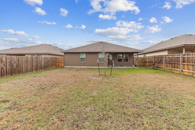 back of property featuring a lawn