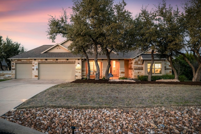 view of front facade with a lawn and a garage