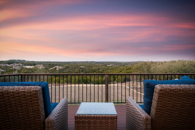 view of balcony at dusk