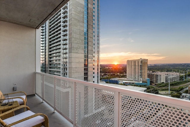 view of balcony at dusk