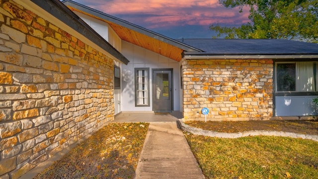 view of exterior entry at dusk