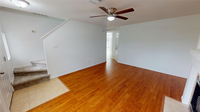 unfurnished room featuring ceiling fan and hardwood / wood-style flooring