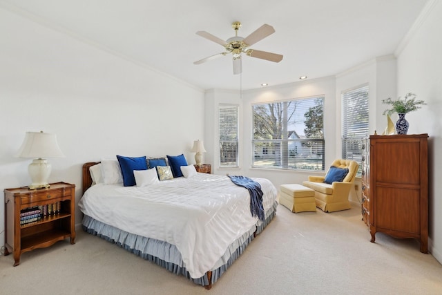 bedroom with crown molding, carpet floors, and ceiling fan