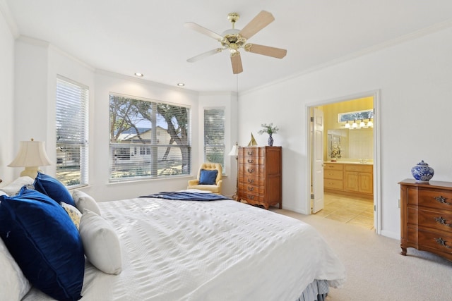 carpeted bedroom with crown molding, ceiling fan, and connected bathroom