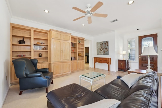 carpeted living room featuring crown molding and ceiling fan