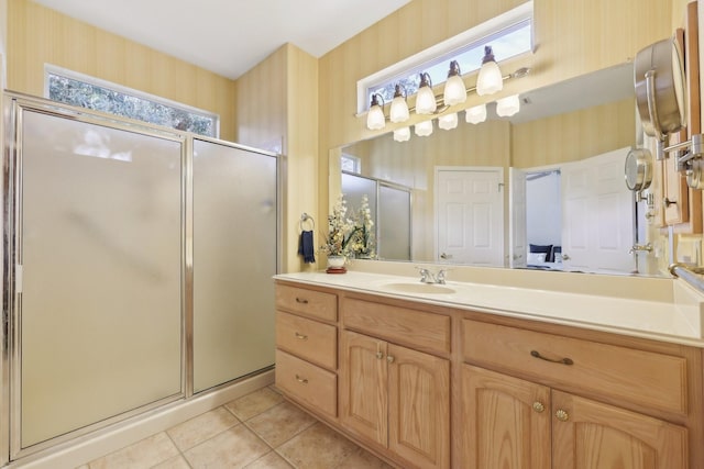 bathroom with vanity, tile patterned flooring, and a shower with door