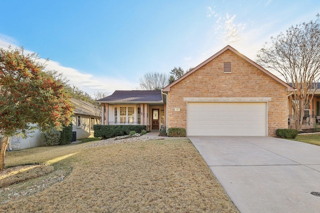 ranch-style home featuring a garage, a front yard, and covered porch