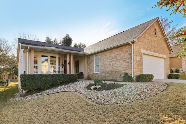 ranch-style house with a garage, a front yard, and covered porch