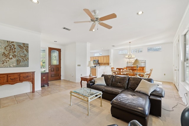 tiled living room featuring crown molding and ceiling fan with notable chandelier