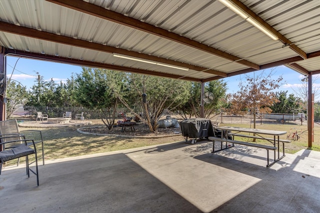 view of patio / terrace featuring an outdoor fire pit