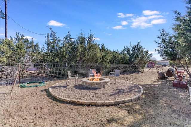 view of yard featuring a fire pit