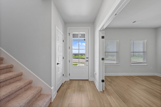 foyer with light hardwood / wood-style floors