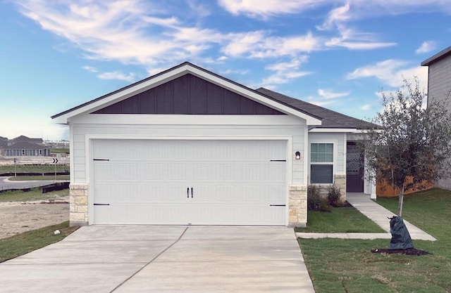 view of front of house with a garage and a front yard