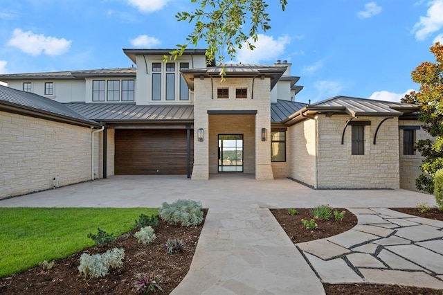 view of front of property featuring a garage