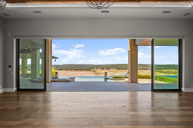 entryway with wood-type flooring