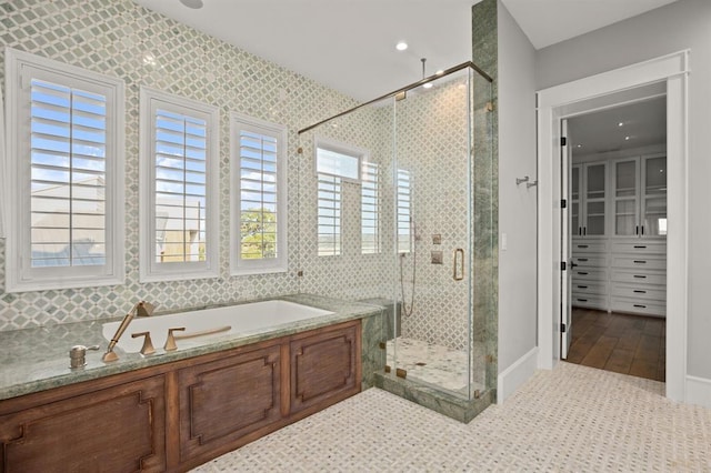 bathroom with plus walk in shower and tile patterned floors