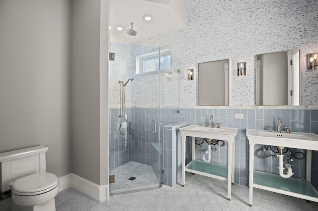 bathroom with tile patterned flooring, decorative backsplash, tile walls, toilet, and walk in shower