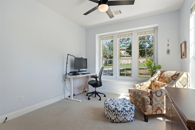 office area with ceiling fan and light carpet