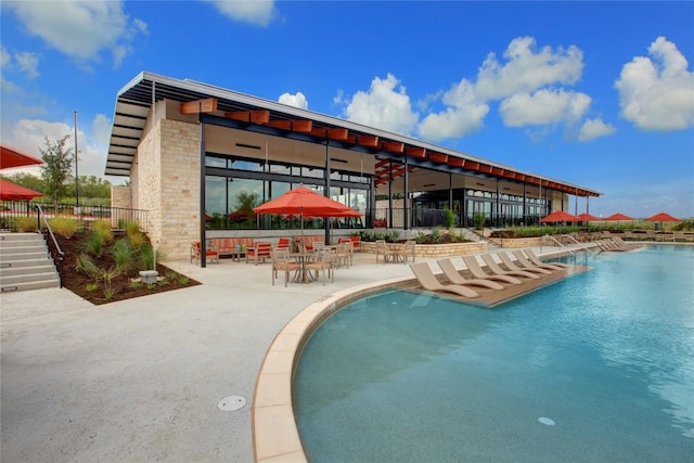 view of swimming pool featuring a patio