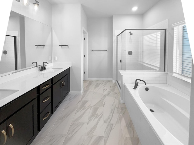 bathroom featuring shower with separate bathtub and vanity