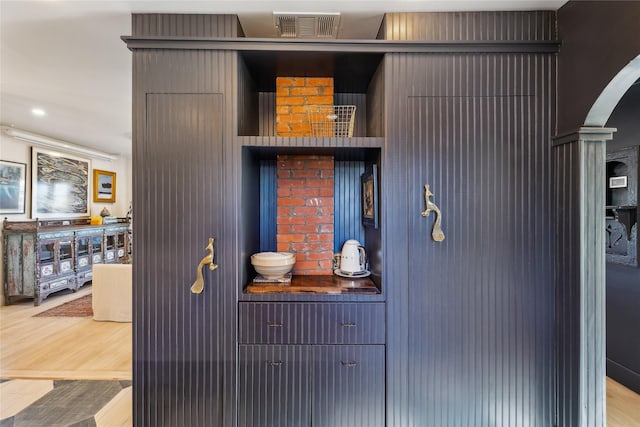 interior details featuring hardwood / wood-style flooring