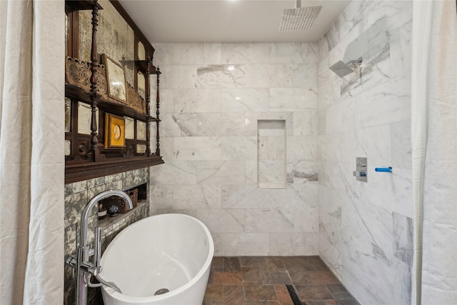 bathroom with tile walls, sink, and plus walk in shower