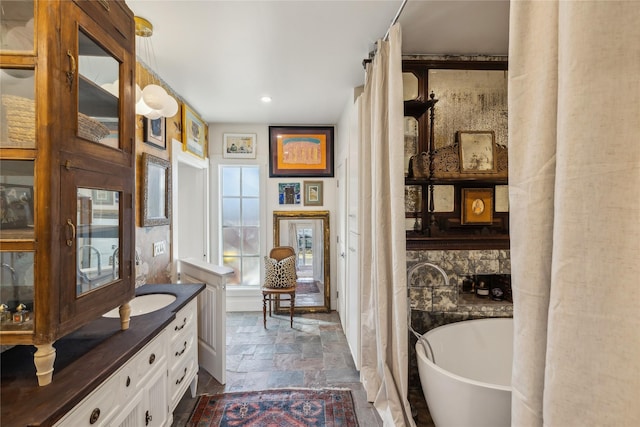 bathroom featuring vanity and a bathing tub