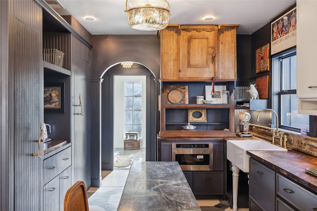 kitchen featuring wood counters and sink