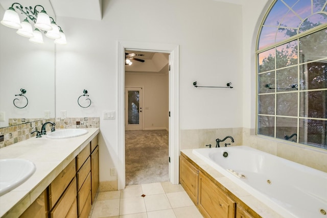 bathroom featuring ceiling fan, tile patterned floors, vanity, and a bath