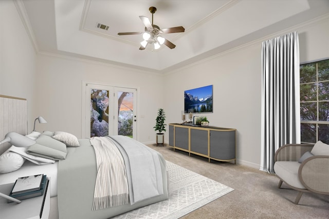 carpeted bedroom featuring a raised ceiling, ceiling fan, access to exterior, and crown molding