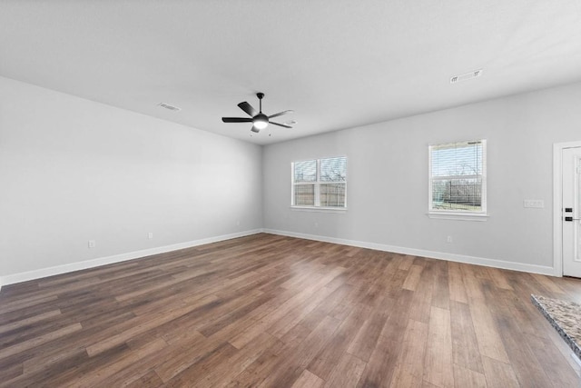 unfurnished room featuring hardwood / wood-style flooring and ceiling fan