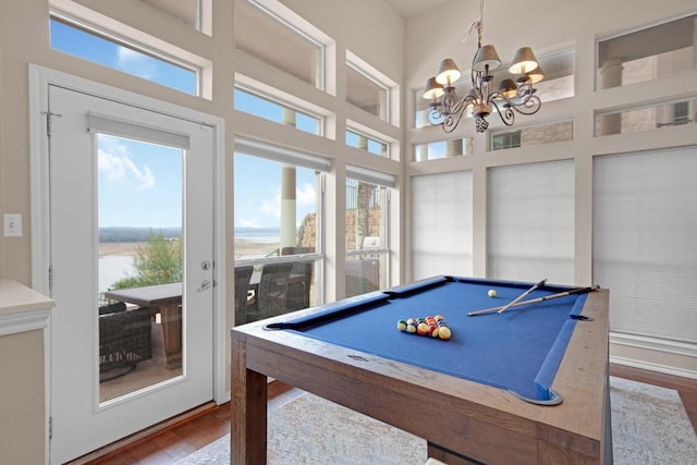 2918 Ranch Road 620 N Unit L-177, Austin, TX 78734 - rec room featuring healthy amount of natural light, wood finished floors, a chandelier, billiards, and a high ceiling
