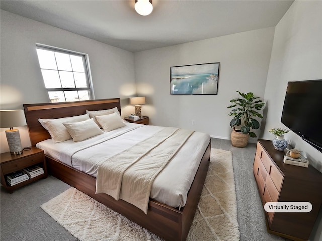 bedroom featuring dark colored carpet