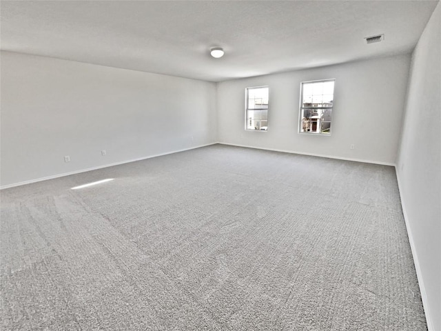 109 Morning Quail Dr, Jarrell, TX 76537 - spare room featuring carpet flooring and baseboards