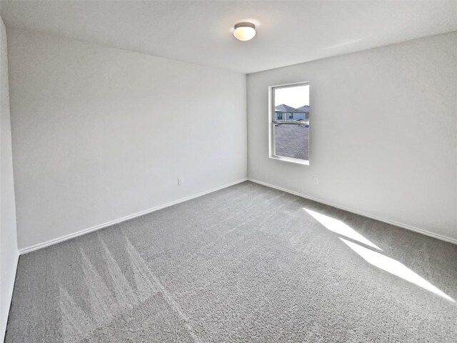 109 Morning Quail Dr, Jarrell, TX 76537 - carpeted empty room with baseboards