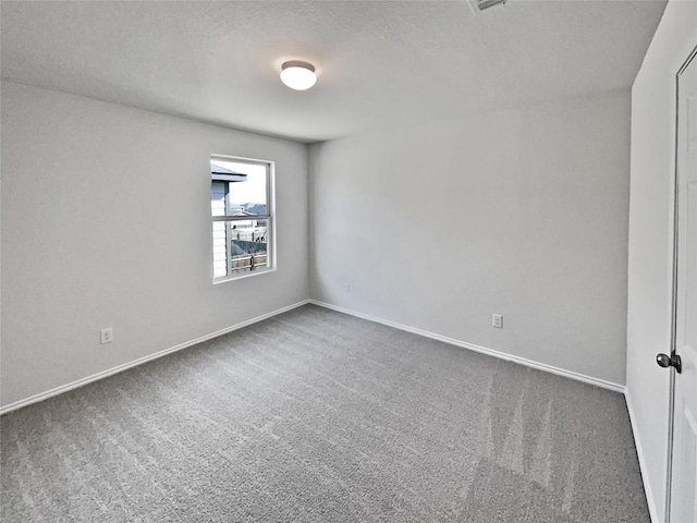 109 Morning Quail Dr, Jarrell, TX 76537 - carpeted spare room featuring baseboards and a textured ceiling