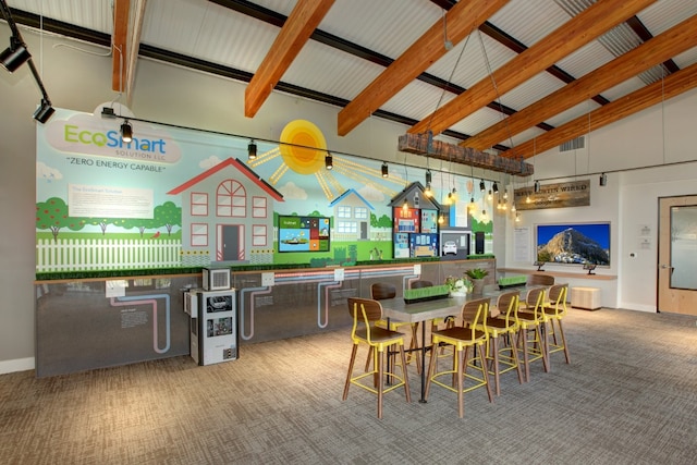 dining room with high vaulted ceiling, light colored carpet, and beam ceiling