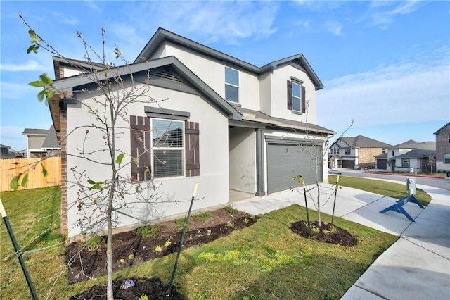 view of front of home with a front lawn and a garage