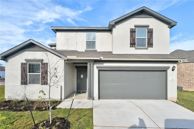 front of property with a garage