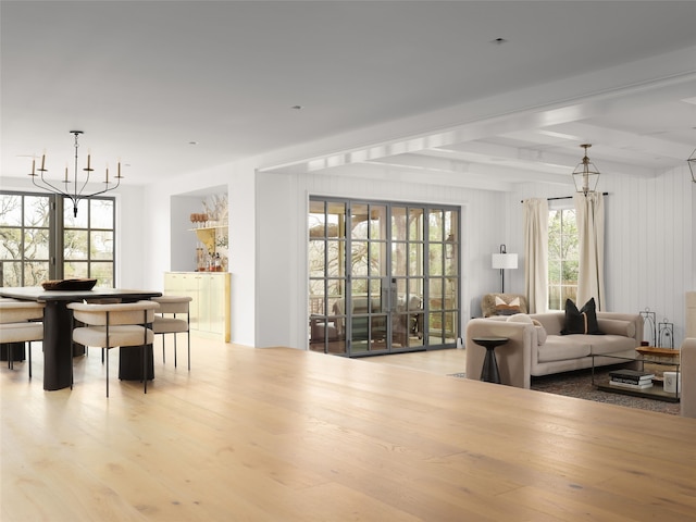 interior space featuring a chandelier and light hardwood / wood-style floors