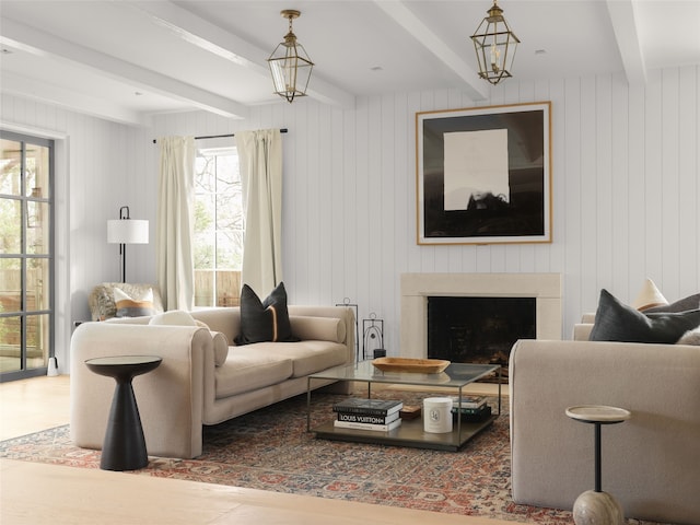 living room featuring wood walls and beamed ceiling