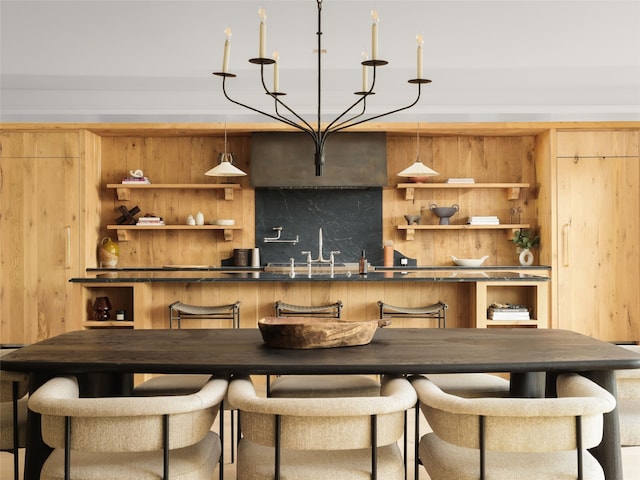 bar with pendant lighting and tasteful backsplash