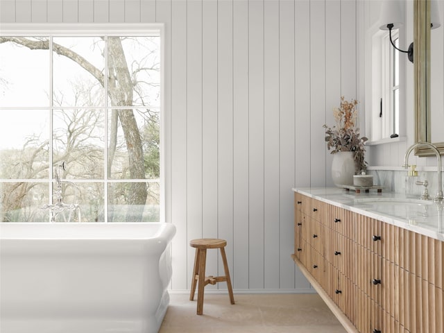 bathroom with a wealth of natural light and vanity