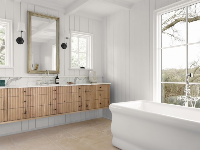 bathroom featuring tile patterned floors, beam ceiling, and vanity