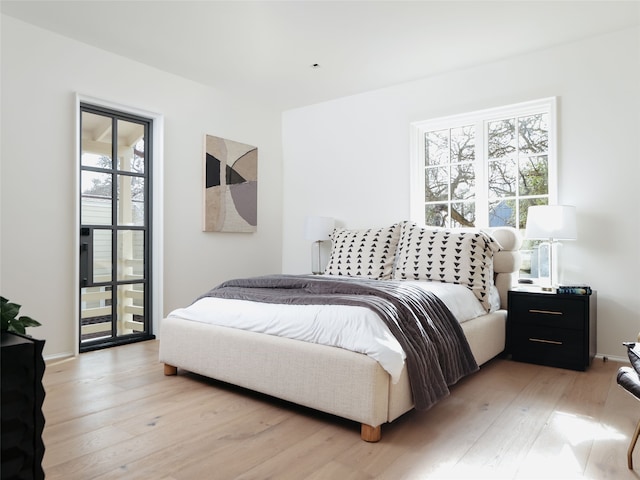 bedroom with light wood-type flooring