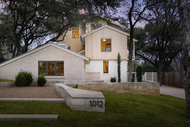 view of front of home with a lawn