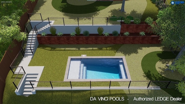 view of pool with fence and a yard